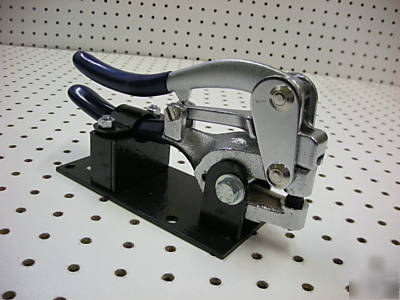 Hand held sheet metal punch with bench mount bracket