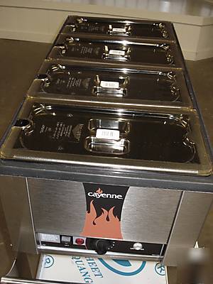Food warmer holds 4 1/3 sized pans w/ servers and lids