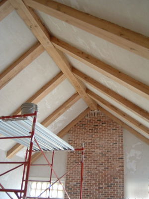 Hand-hewn box beams from reclaimed barn beams