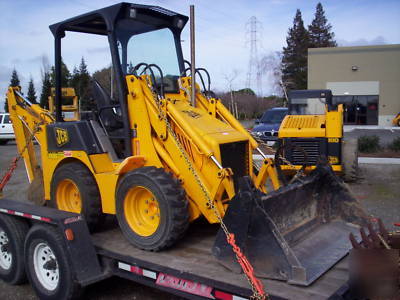 Jcb 208S backhoe loader w/skid steer atachment mount