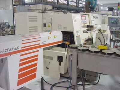 Okuma 4-axis cnc turning center w/barfeeder & robot