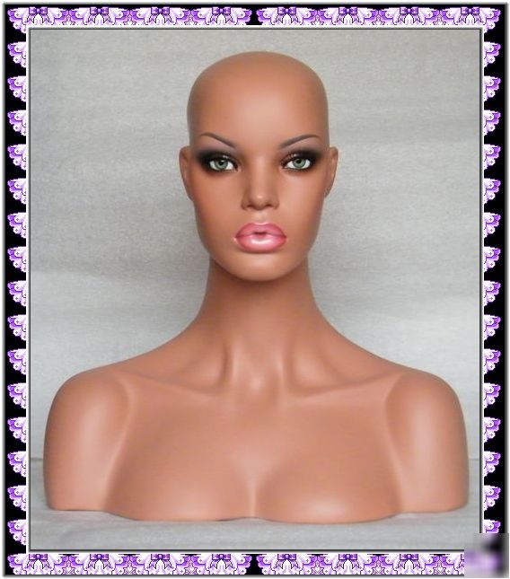 Realistic mannequin head bust with green glass eyes