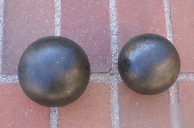 Concrete pump parts:(2) steel balls, 4 in & 4 1/2 in