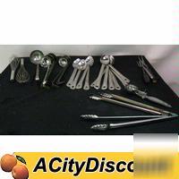 Assorted kitchen serving cooking tongs ladels utensils
