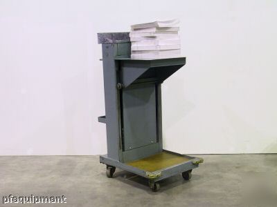 The spring actuated, self-leveling bindery cart