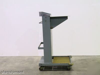 The spring actuated, self-leveling bindery cart