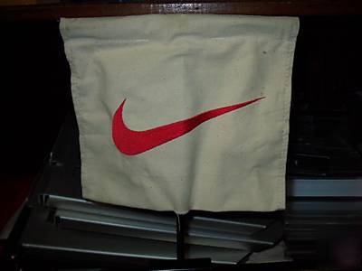Nike swoosh magnetic canvas signs on metal pole fixture