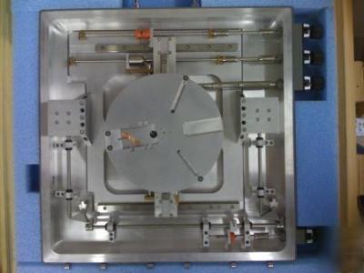 Precision wafer positioner, translation & rotation