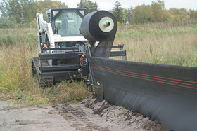 Bobcat silt fence installer attachment for skid steer