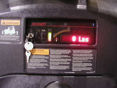 (2) schaeff W40 electric stand-up forklift low hours