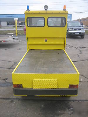 Cushman electric utility cart with flatbed full cab